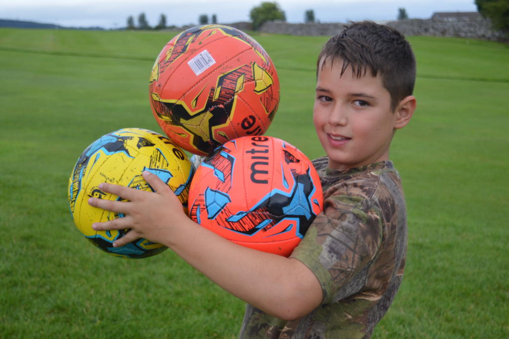 boy-holding-football-put2golf-penrith-golf-football-stag-party-lake-district-elle-blonde-luxury-lifestyle-destination-blog